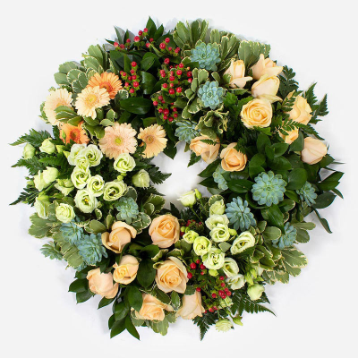 Eco Wreath SYM-354 - Open Style Wreath on Eco base. Ring 40cm / 16” *Fine Print: Every product is hand made and delivered by the local florist. Pictures shown are recent examples of an actual arrangement that was designed by talented florists! Please note that each individual florist cannot guarantee what the flower varieties or colours will be (unless specified on the product description), they will guarantee that your specific arrangement will be fresh and beautiful.